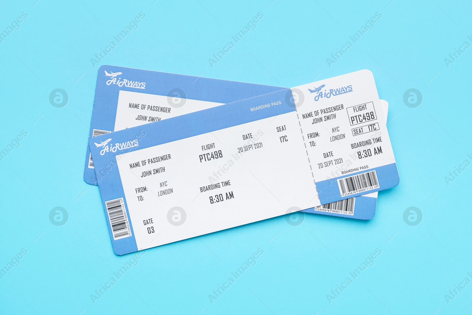 Photo of Travel agency. Flight tickets on light blue background, top view