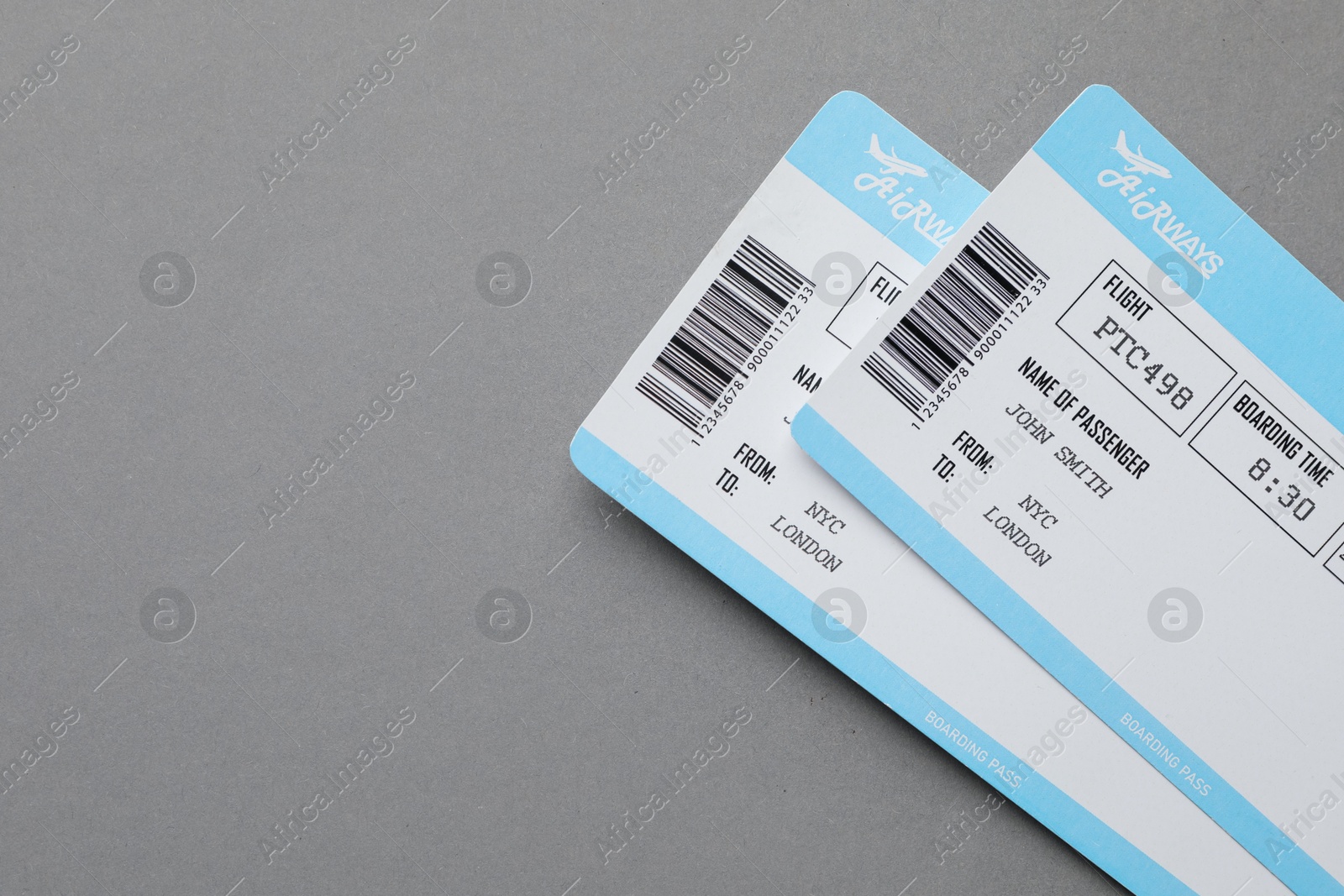 Photo of Travel agency. Flight tickets on grey background, top view. Space for text