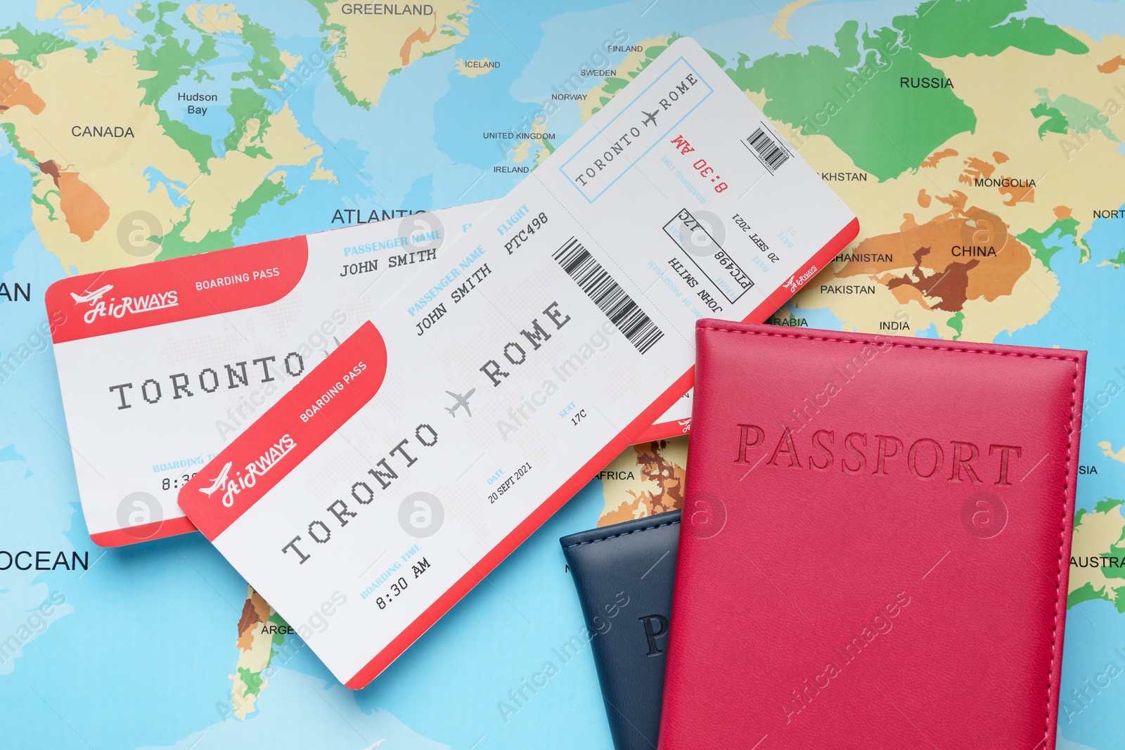 Photo of Travel agency. Flight tickets and passports on world map, flat lay