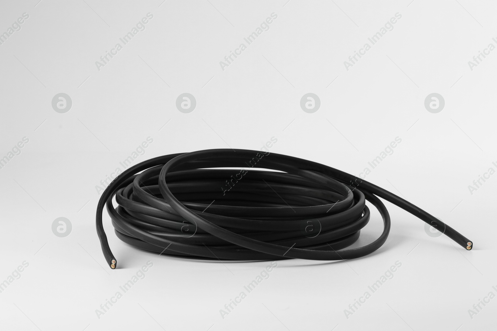 Photo of Insulated black electrical wire isolated on white