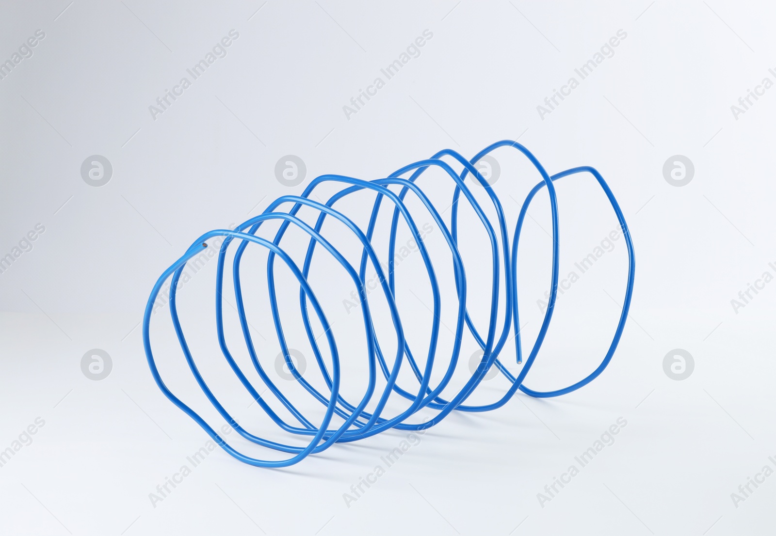 Photo of One blue electrical wire isolated on white