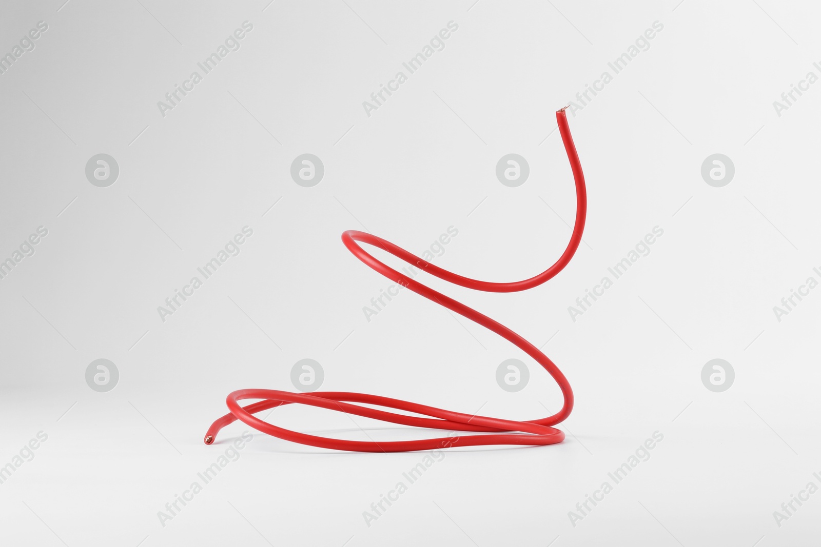 Photo of One red electrical wire isolated on white