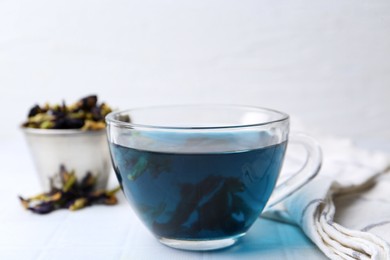 Photo of Delicious butterfly pea flower tea on white table