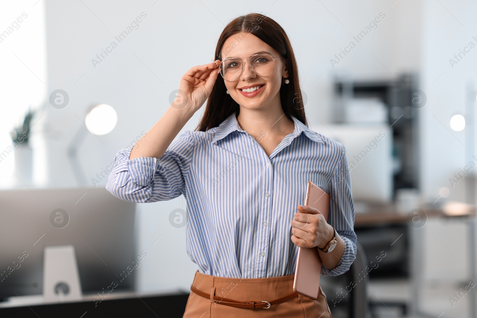 Photo of Portrait of banker with tablet in office