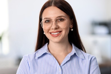 Photo of Portrait of banker with glasses in office