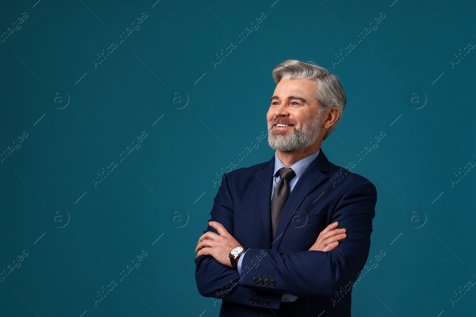 Photo of Banker with crossed arms on blue background, space for text