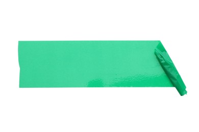 Photo of Strip of green adhesive tape isolated on white, top view