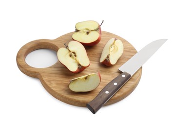 Photo of Wooden cutting board with cut apples and knife isolated on white