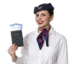 Photo of Happy stewardess holding passport with flight tickets on white background