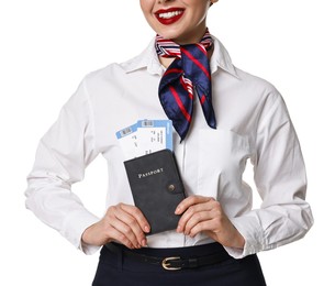 Photo of Happy stewardess holding passport with flight tickets on white background, closeup