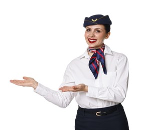 Photo of Smiling stewardess showing something on white background