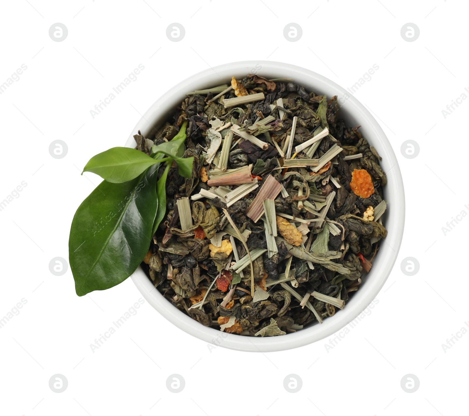 Photo of Dried and fresh tea leaves in bowl isolated on white, top view