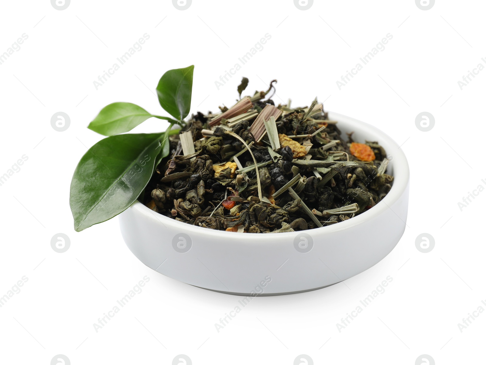 Photo of Dried and fresh tea leaves in bowl isolated on white