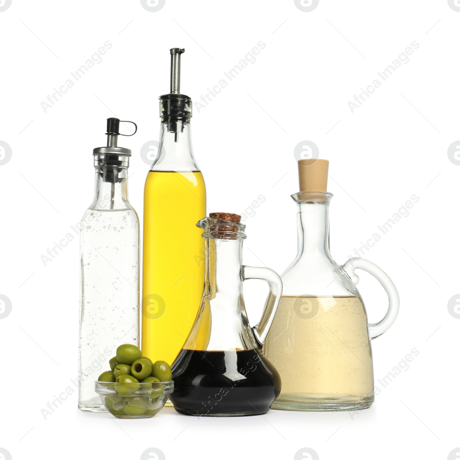 Photo of Salad dressings and olives isolated on white