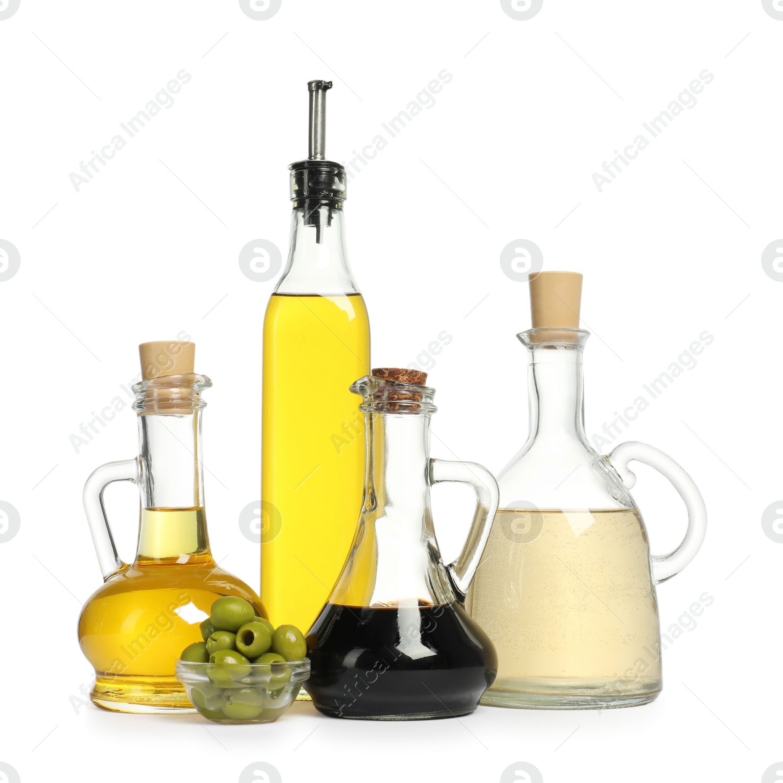 Photo of Salad dressings and olives isolated on white