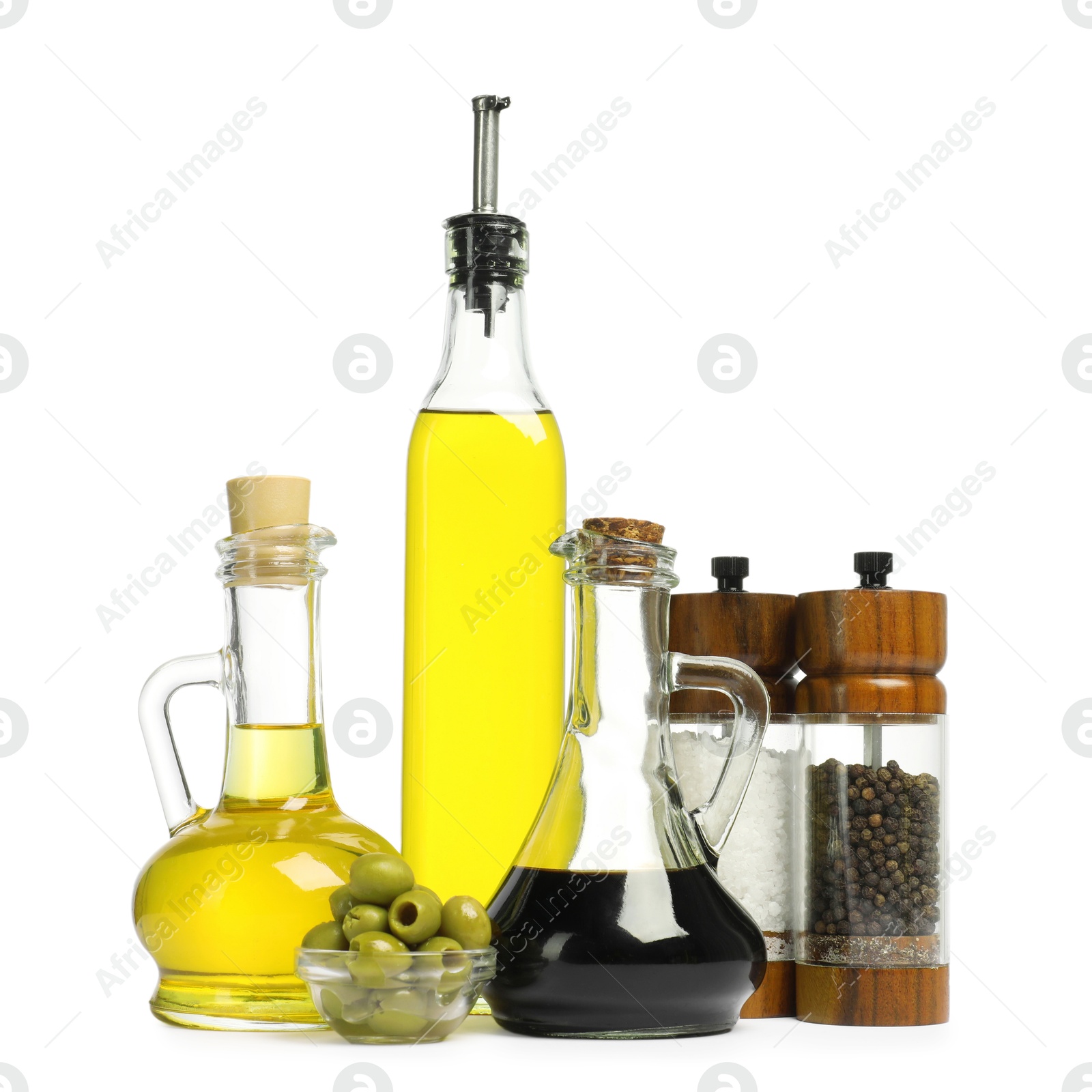 Photo of Salad dressings, spices and olives isolated on white