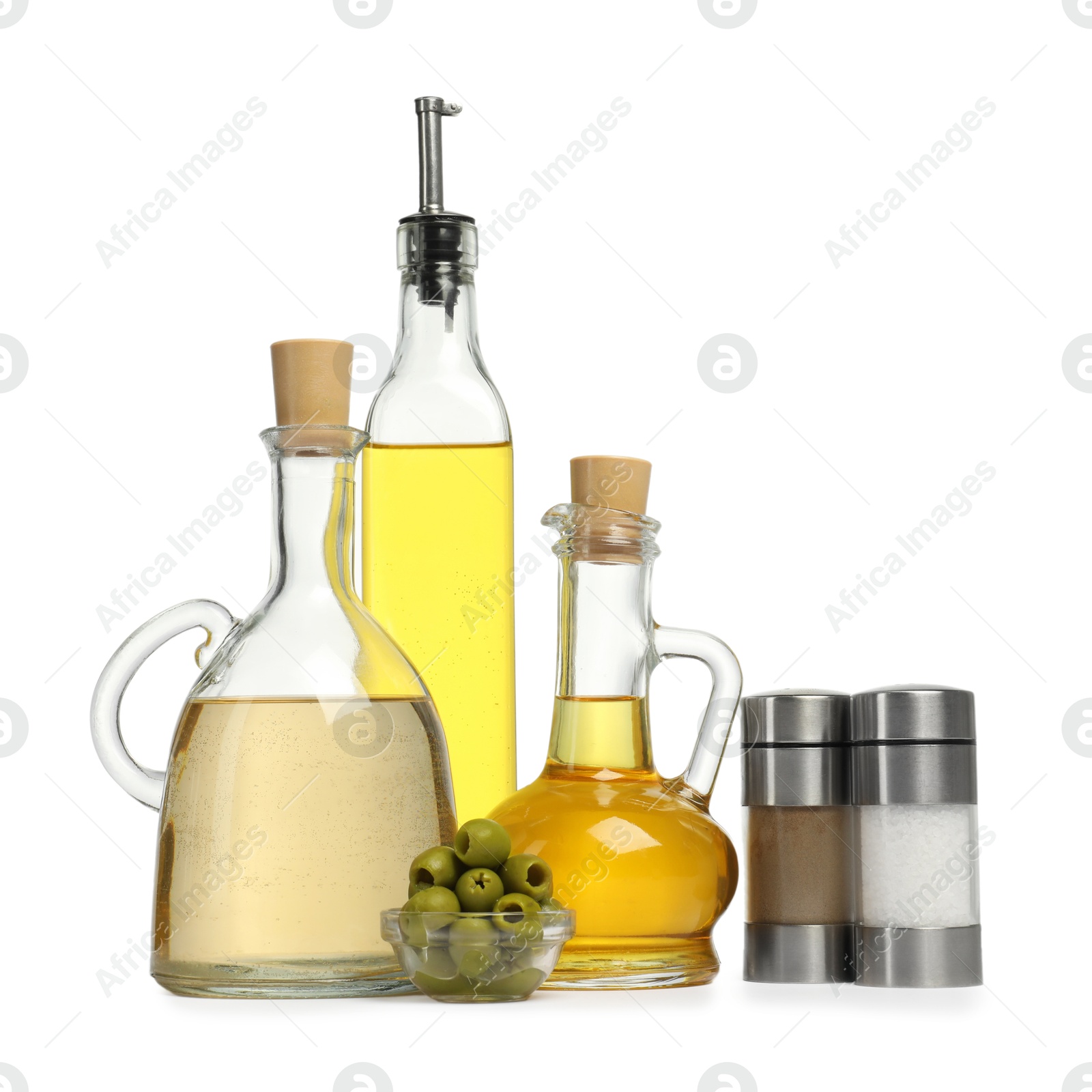 Photo of Salad dressings, spices and olives isolated on white