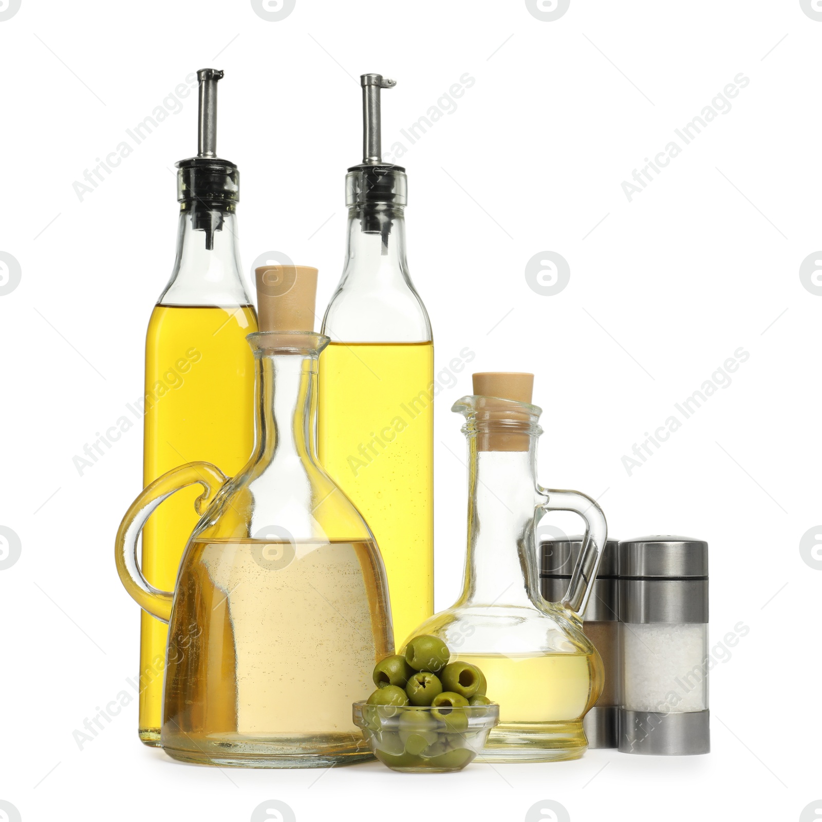 Photo of Salad dressings, spices and olives isolated on white