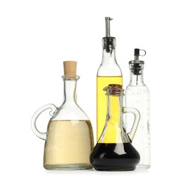 Photo of Oil and vinegar in bottles isolated on white