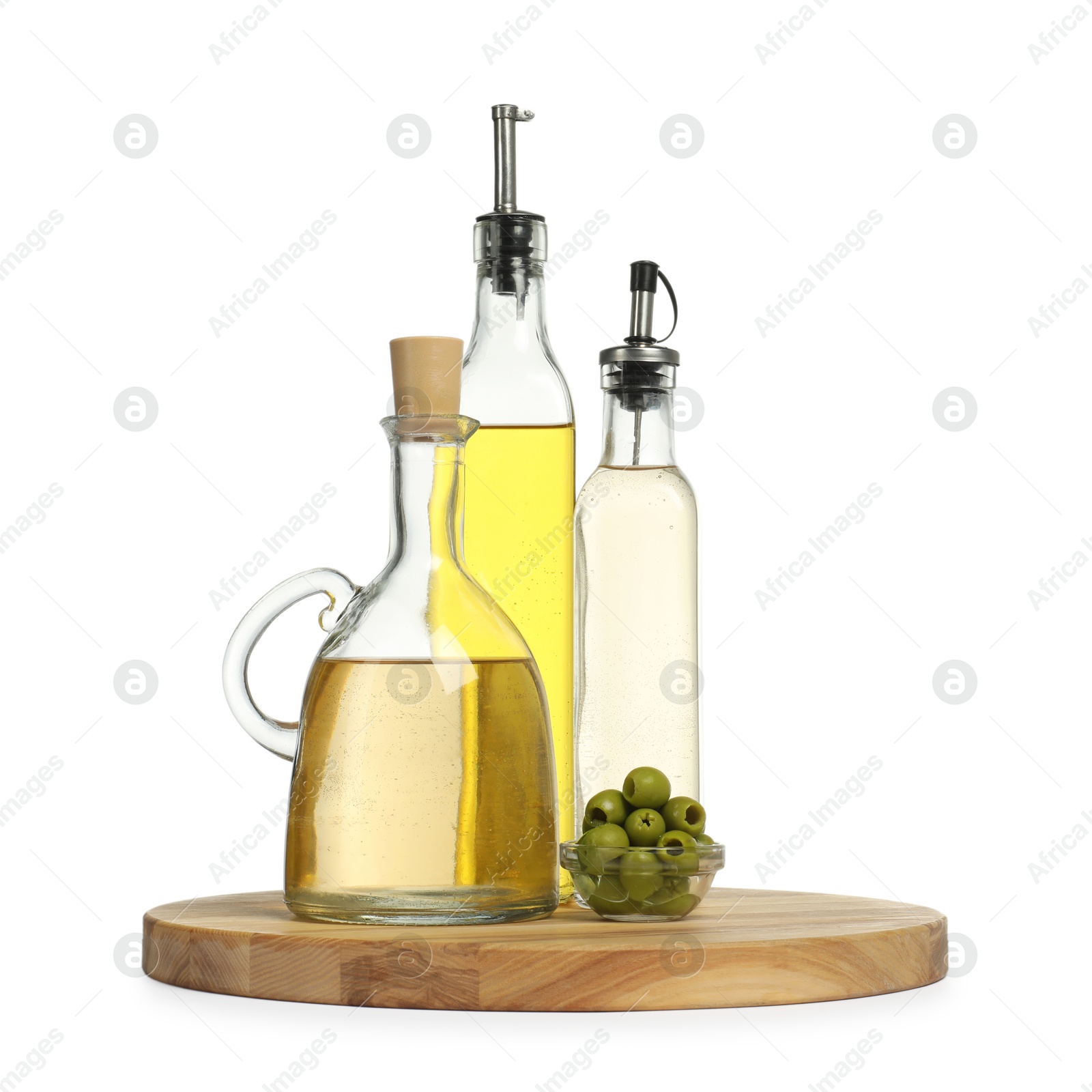 Photo of Salad dressings and olives isolated on white