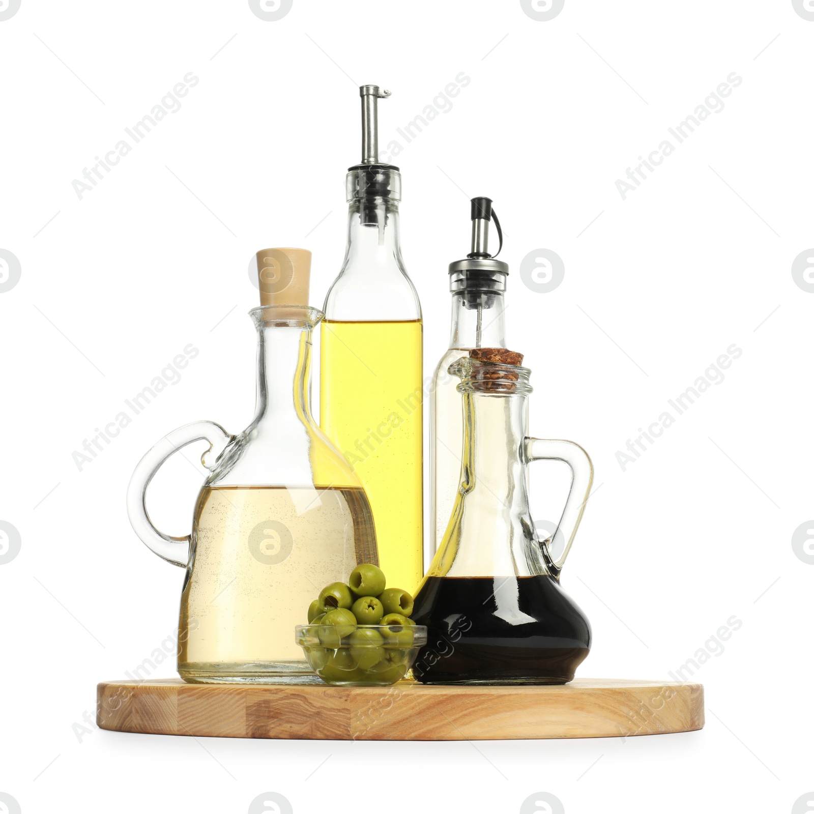 Photo of Salad dressings and olives isolated on white