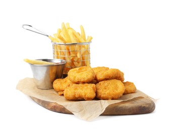 Photo of Tasty chicken nuggets, potato fries and sauce isolated on white