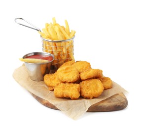 Photo of Tasty chicken nuggets, potato fries and ketchup isolated on white