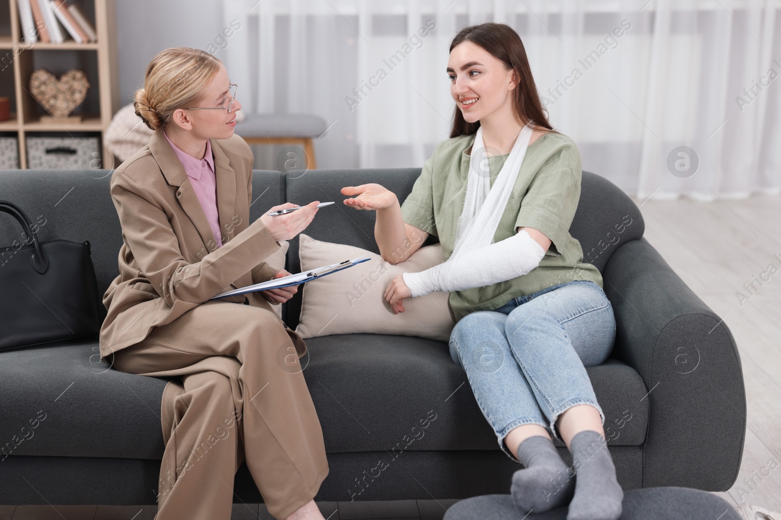 Photo of Injured woman having meeting with lawyer in office