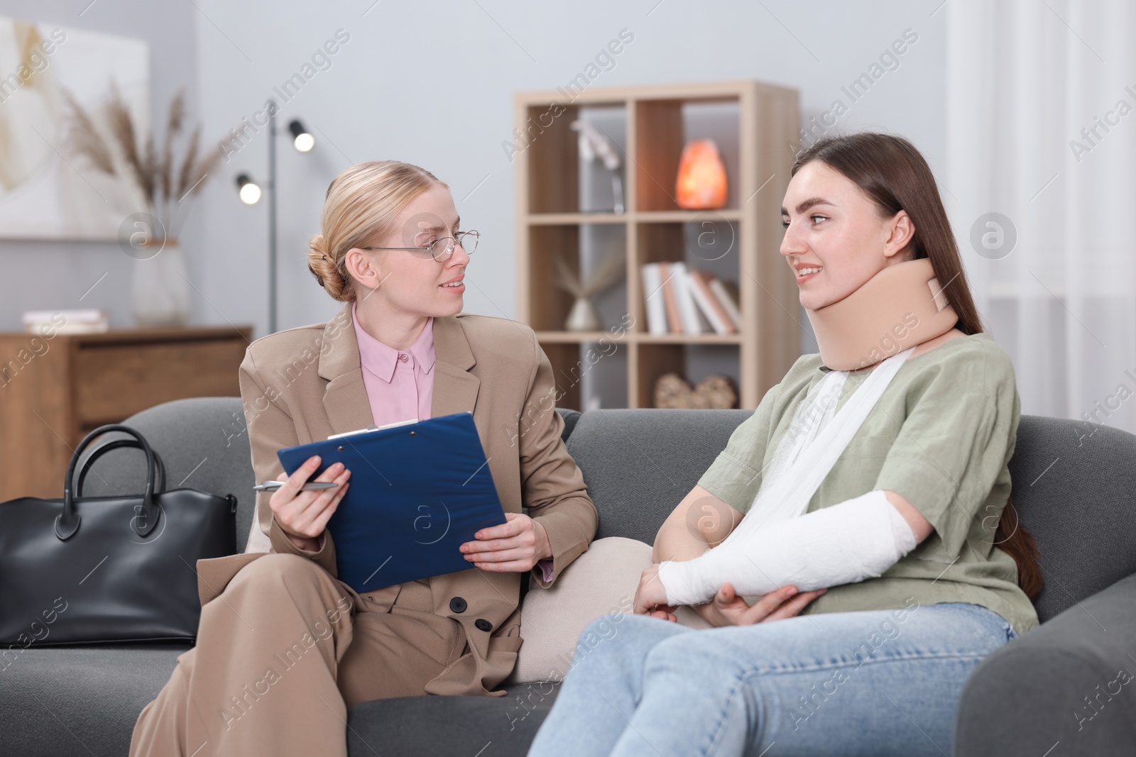 Photo of Injured woman having meeting with lawyer in office