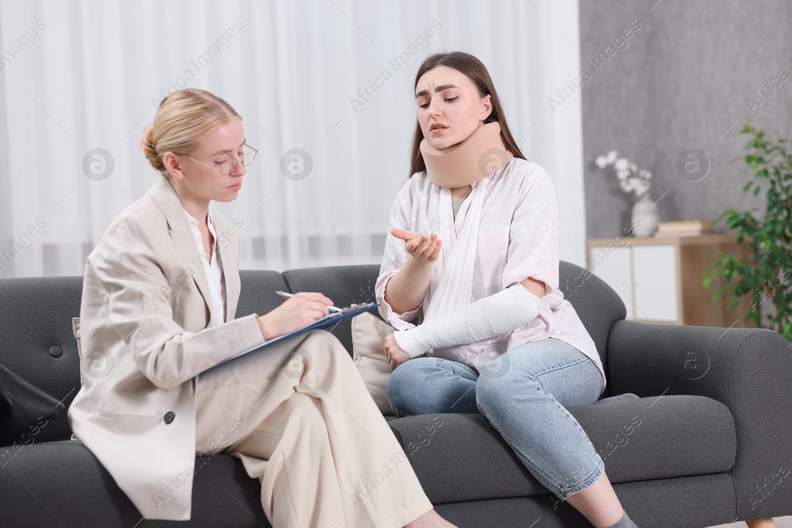 Photo of Injured woman having meeting with lawyer in office