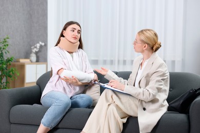 Photo of Injured woman having meeting with lawyer in office