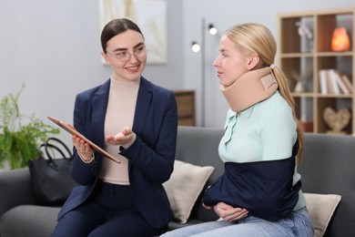 Photo of Injured woman having meeting with lawyer in office