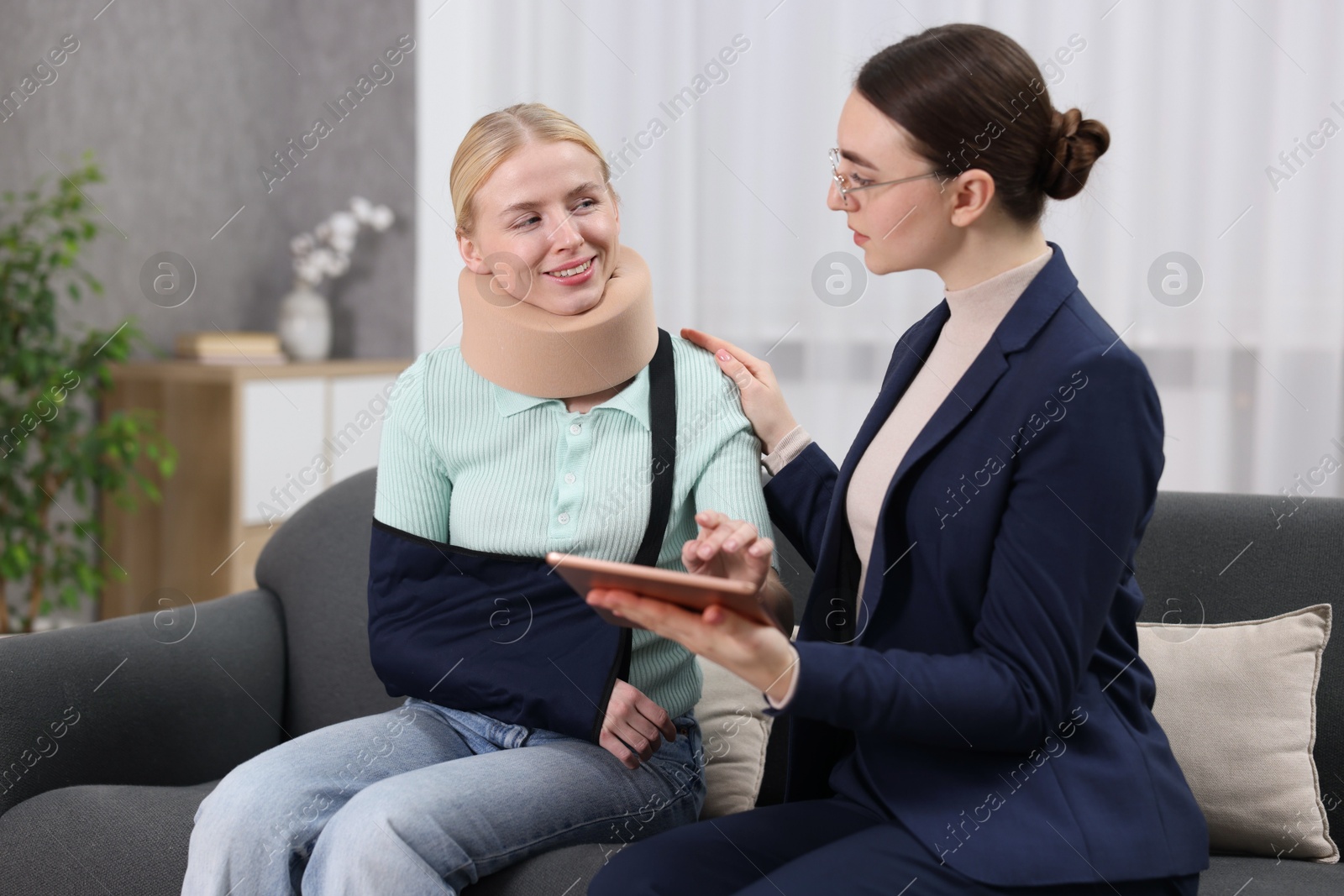 Photo of Injured woman having meeting with lawyer in office