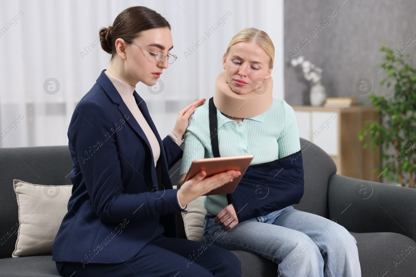 Photo of Injured woman having meeting with lawyer in office