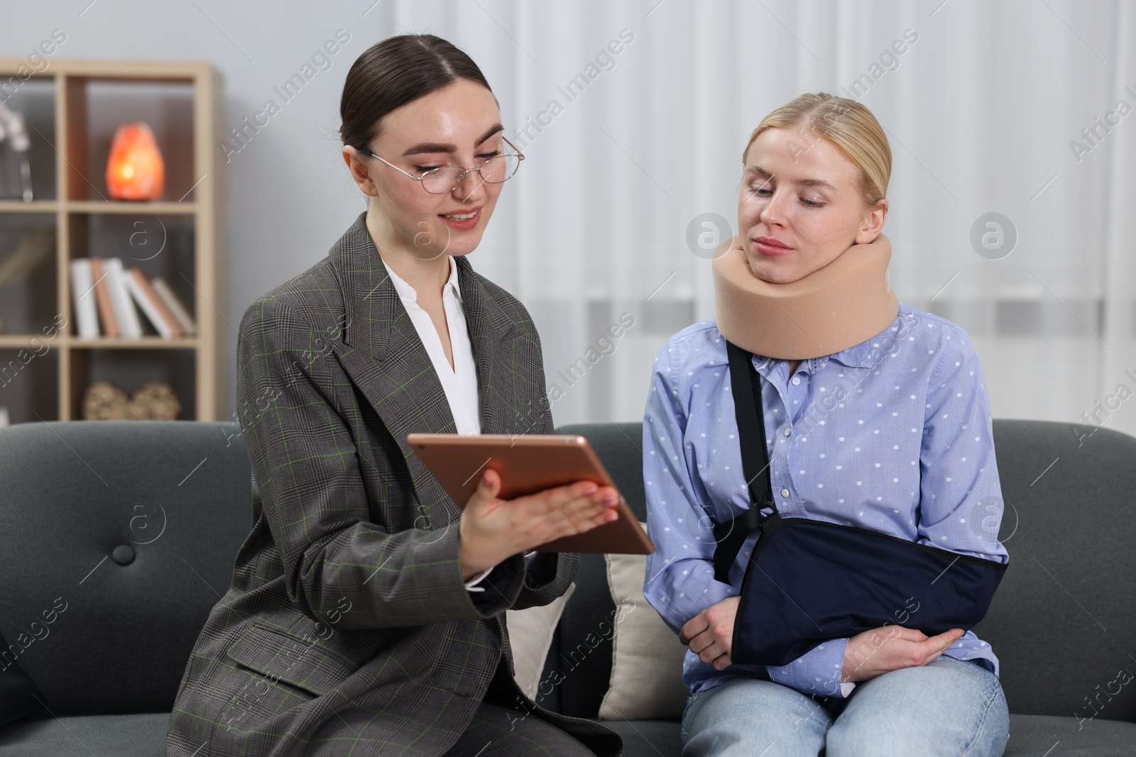 Photo of Injured woman having meeting with lawyer in office