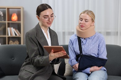 Photo of Injured woman having meeting with lawyer in office