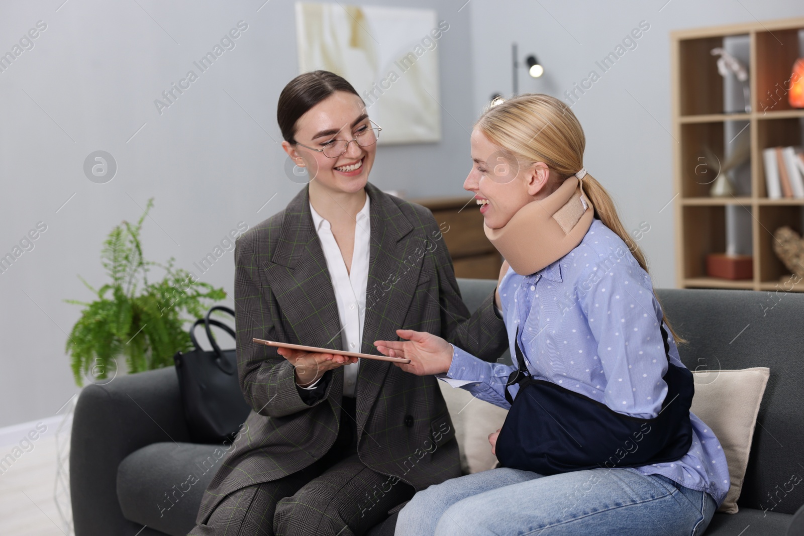 Photo of Injured woman having meeting with lawyer in office