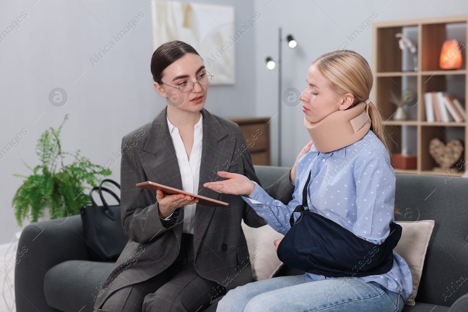 Photo of Injured woman having meeting with lawyer in office