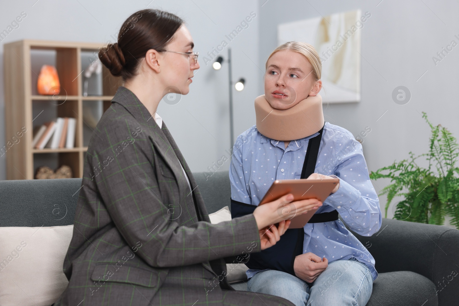 Photo of Injured woman having meeting with lawyer in office