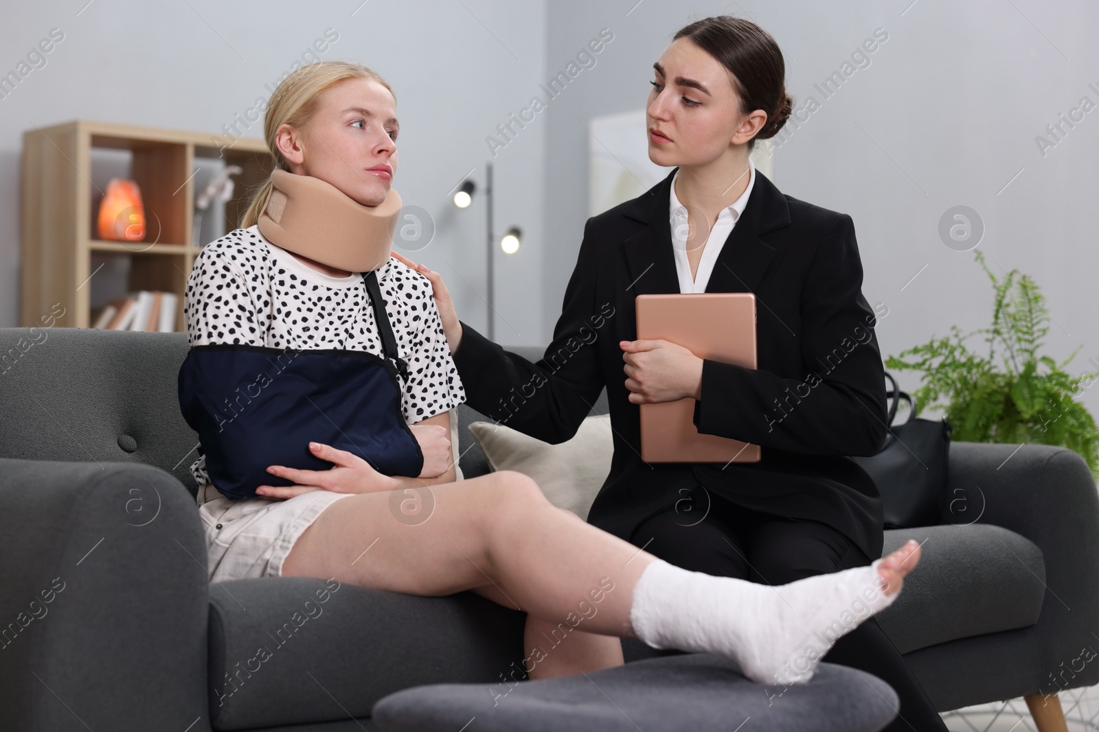 Photo of Injured woman having meeting with lawyer in office