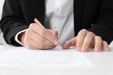 Photo of Man signing marriage contract at desk, closeup