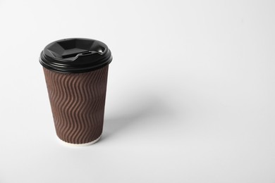 Photo of Paper cup with lid on white background. Mockup for design