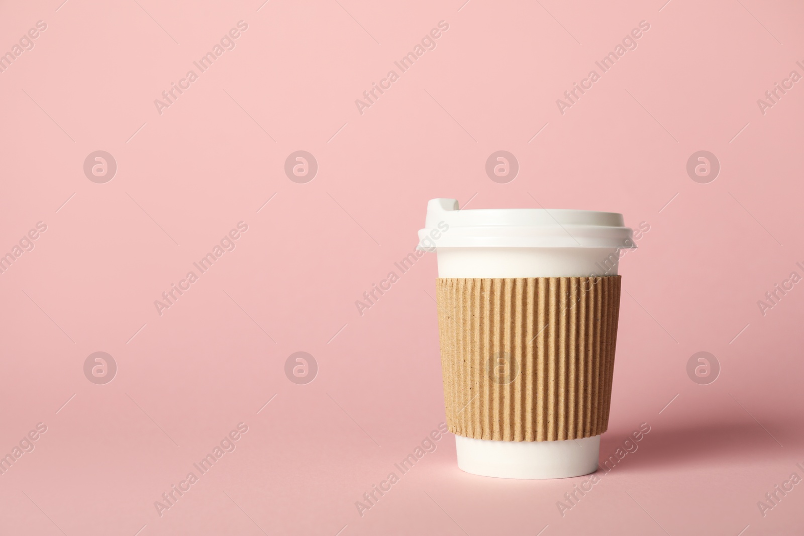 Paper cup on pink background. Mockup for design Photo of Paper cup on pink background. Mockup for design