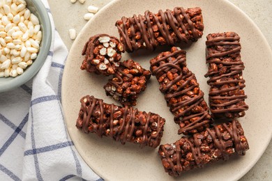 Photo of Delicious chocolate puffed rice bars on table, flat lay