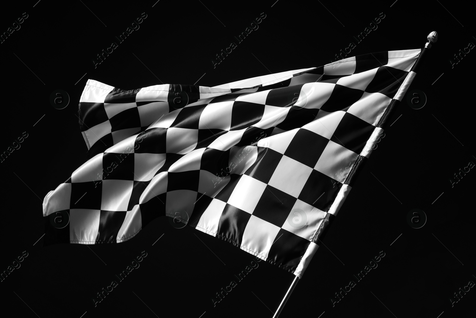 Photo of One racing checkered flag on black background