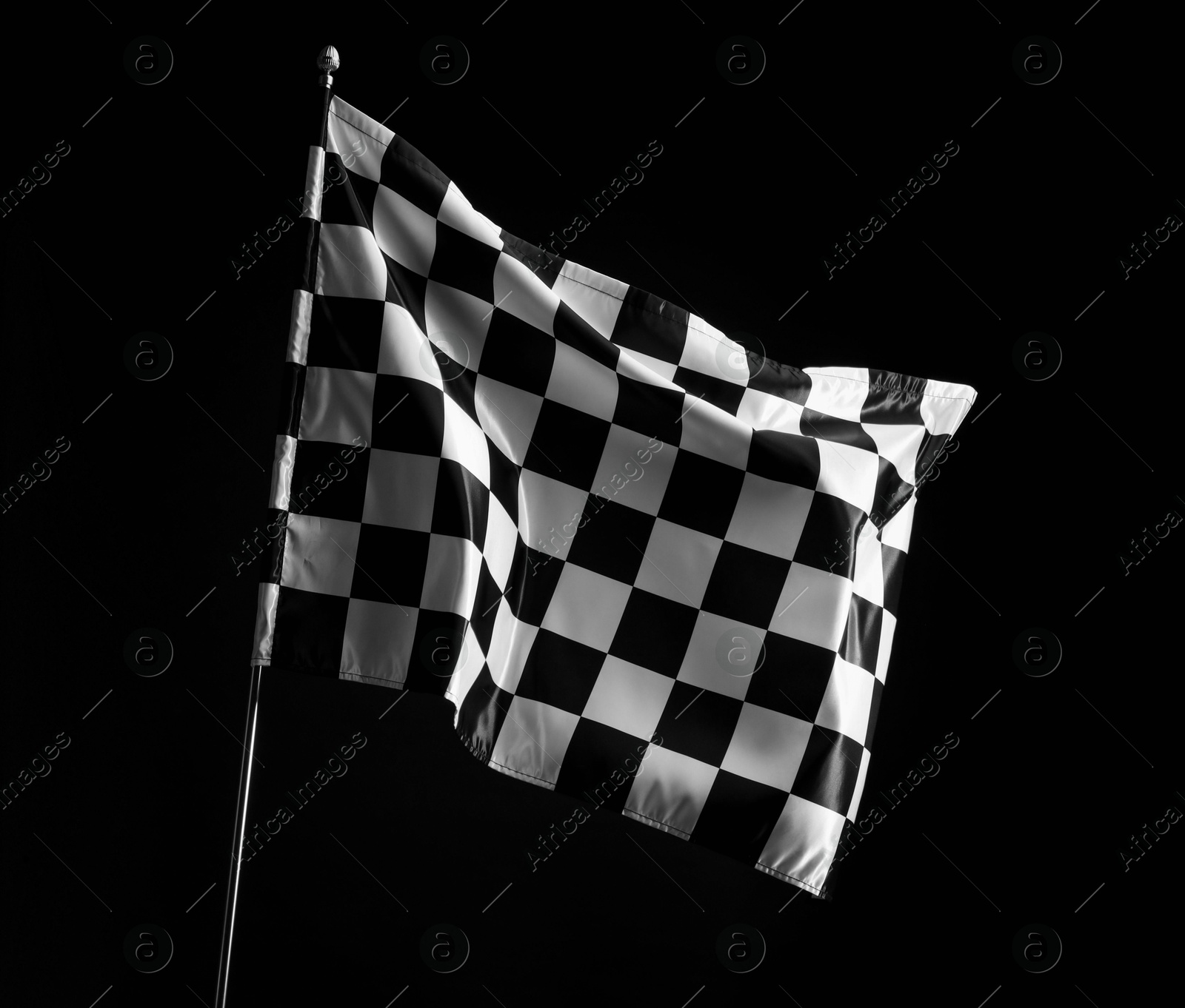 Photo of One racing checkered flag on black background