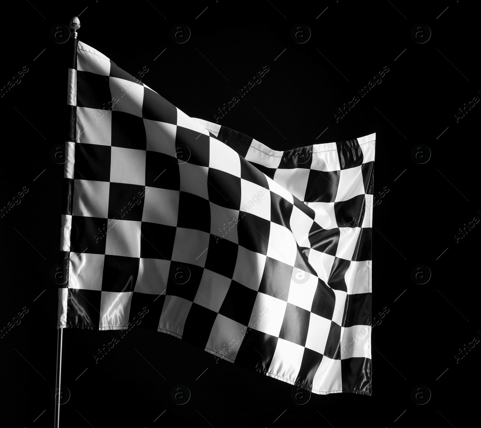 Photo of One racing checkered flag on black background, space for text