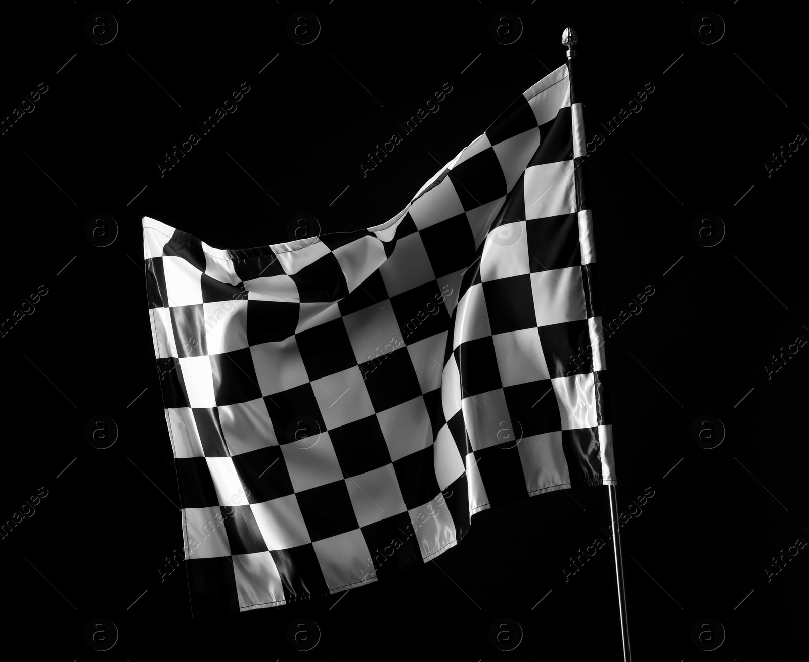 Photo of One racing checkered flag on black background