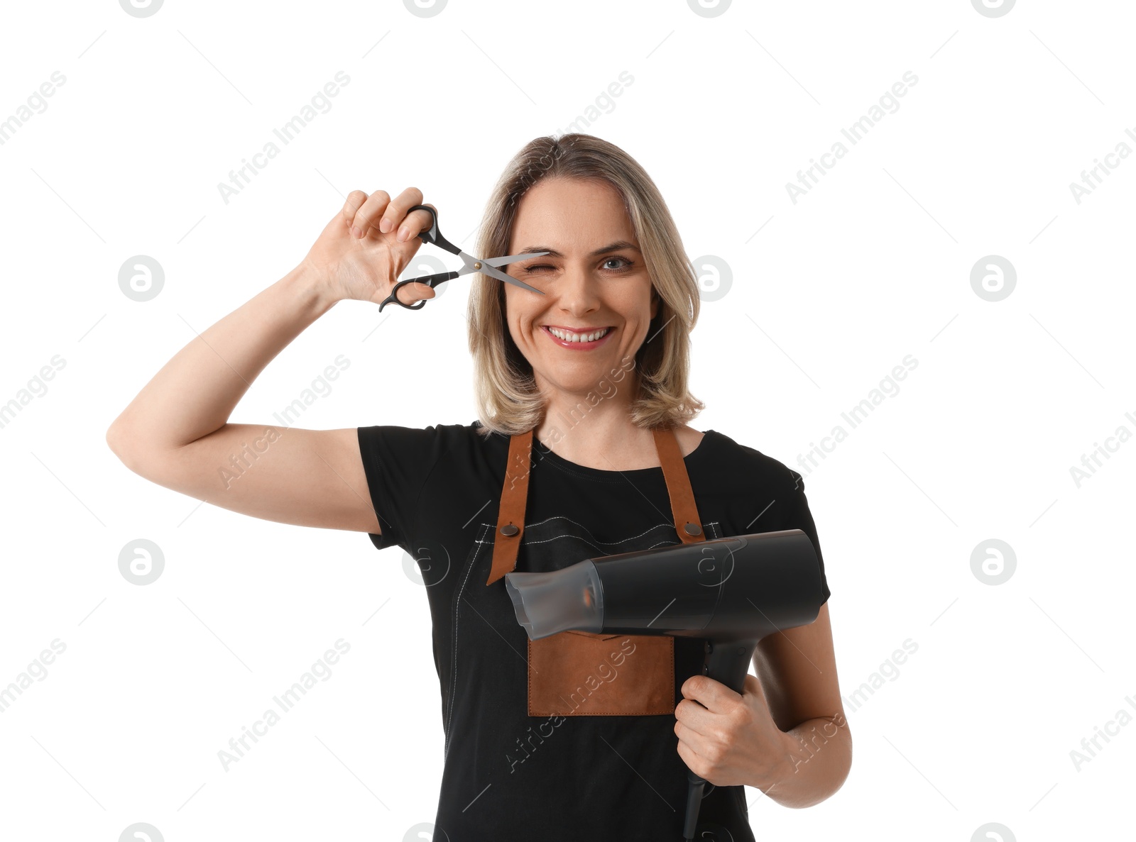 Photo of Smiling hairdresser with dryer and scissors on white background