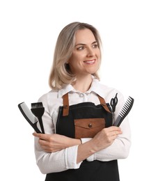 Photo of Smiling hairdresser with combs, hair dye brush and scissors on white background